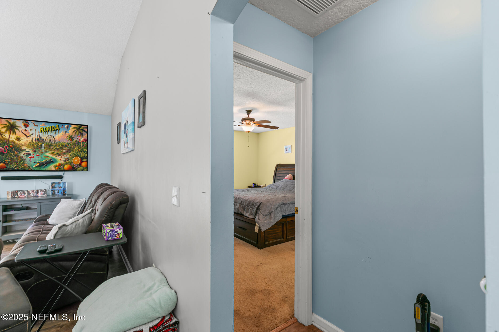 1725 South Summer Ridge Court St. Augustine, FL 32092 - Photo 28 of 46 a living room with furniture and a flat screen tv