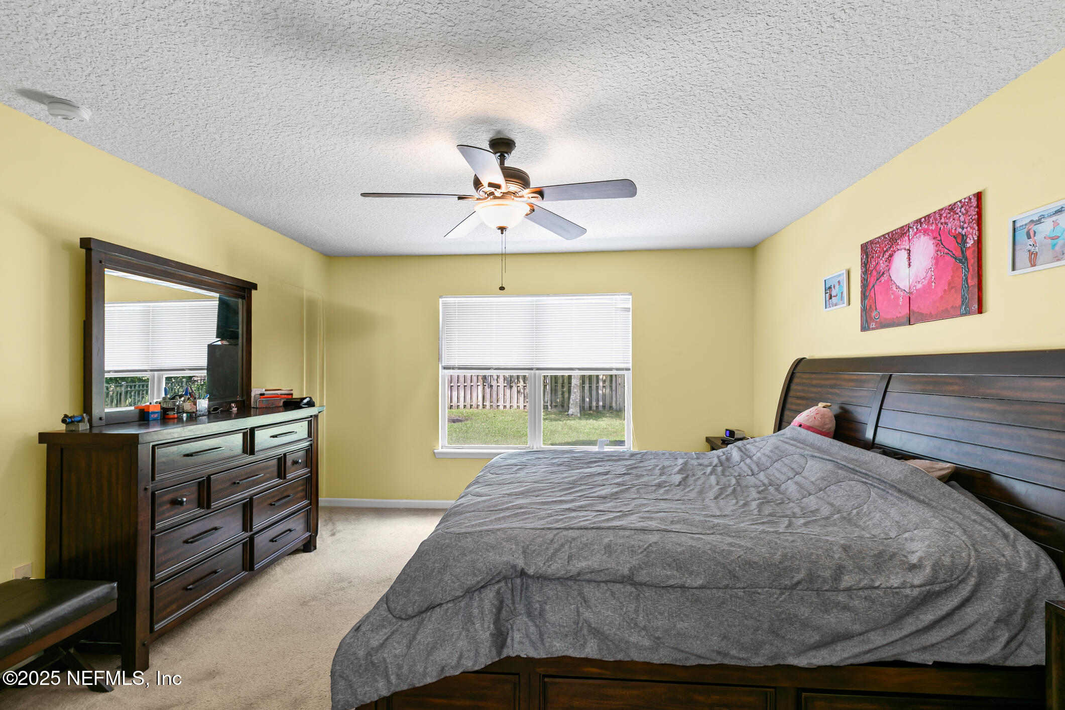 1725 South Summer Ridge Court St. Augustine, FL 32092 - Photo 30 of 46 a bedroom with a bed and a flat screen tv