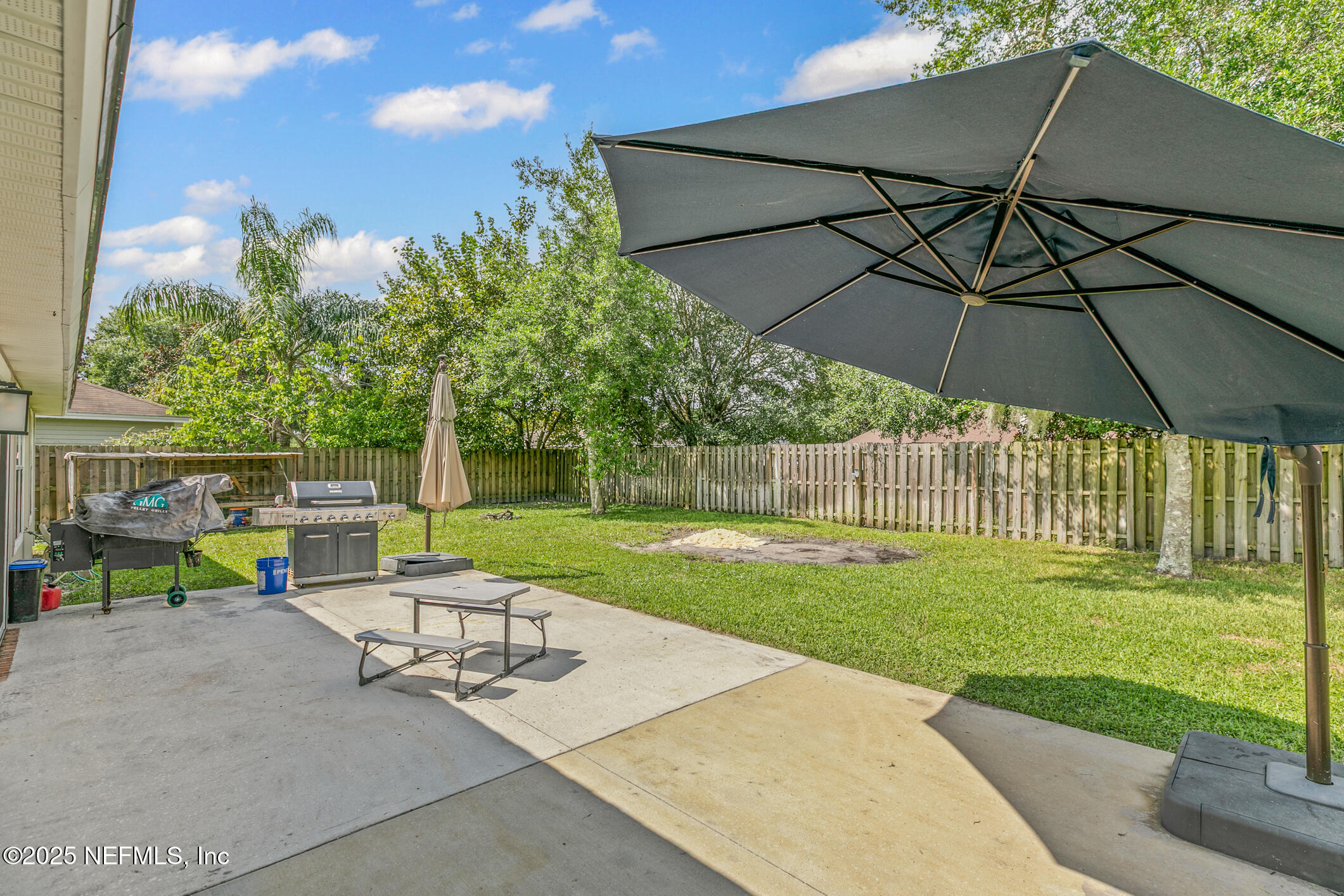1725 South Summer Ridge Court St. Augustine, FL 32092 - Photo 40 of 46 a view of a chair and table in the garden