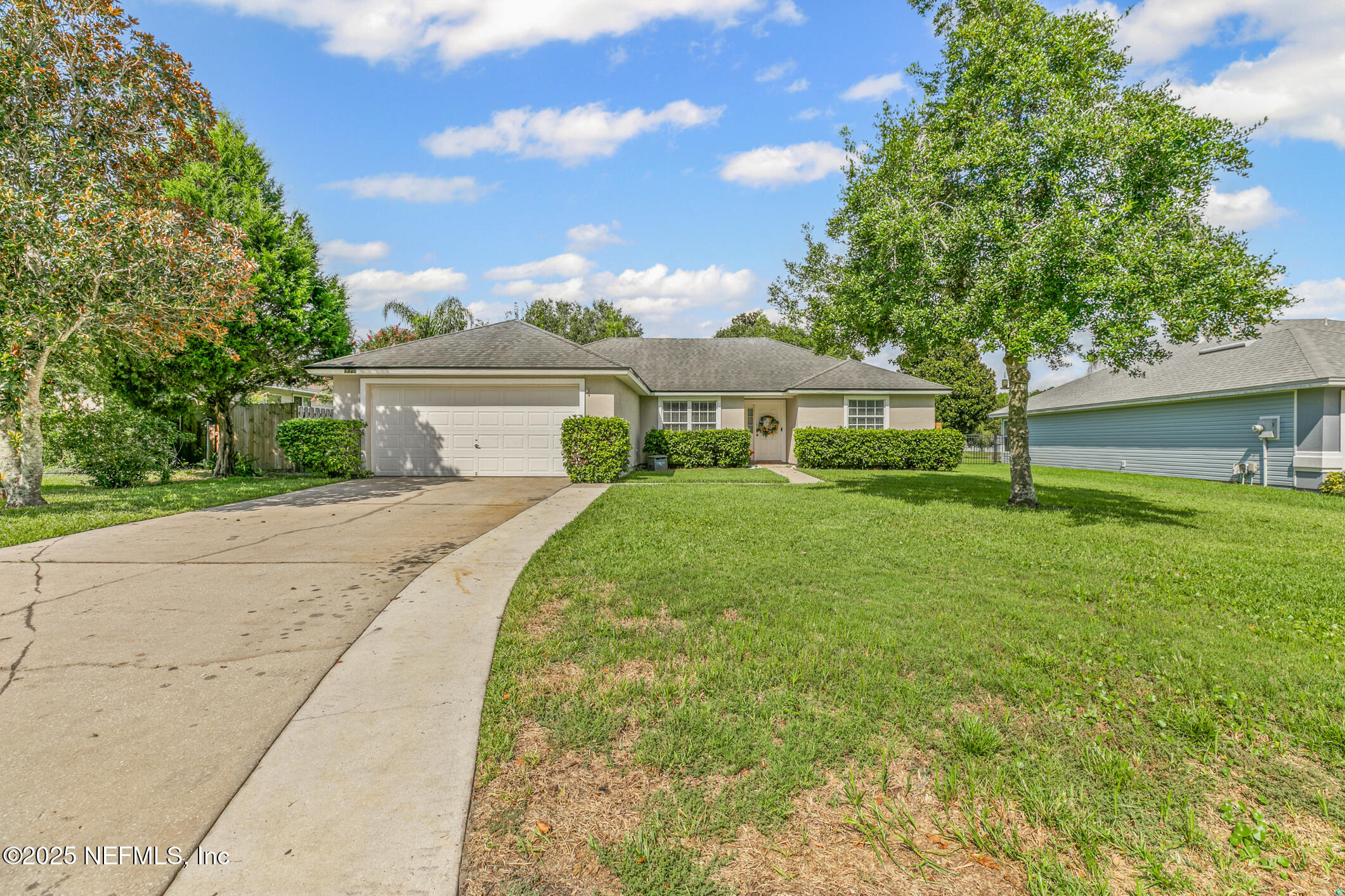1725 South Summer Ridge Court St. Augustine, FL 32092 - Photo 4 of 46 a front view of a house with garden