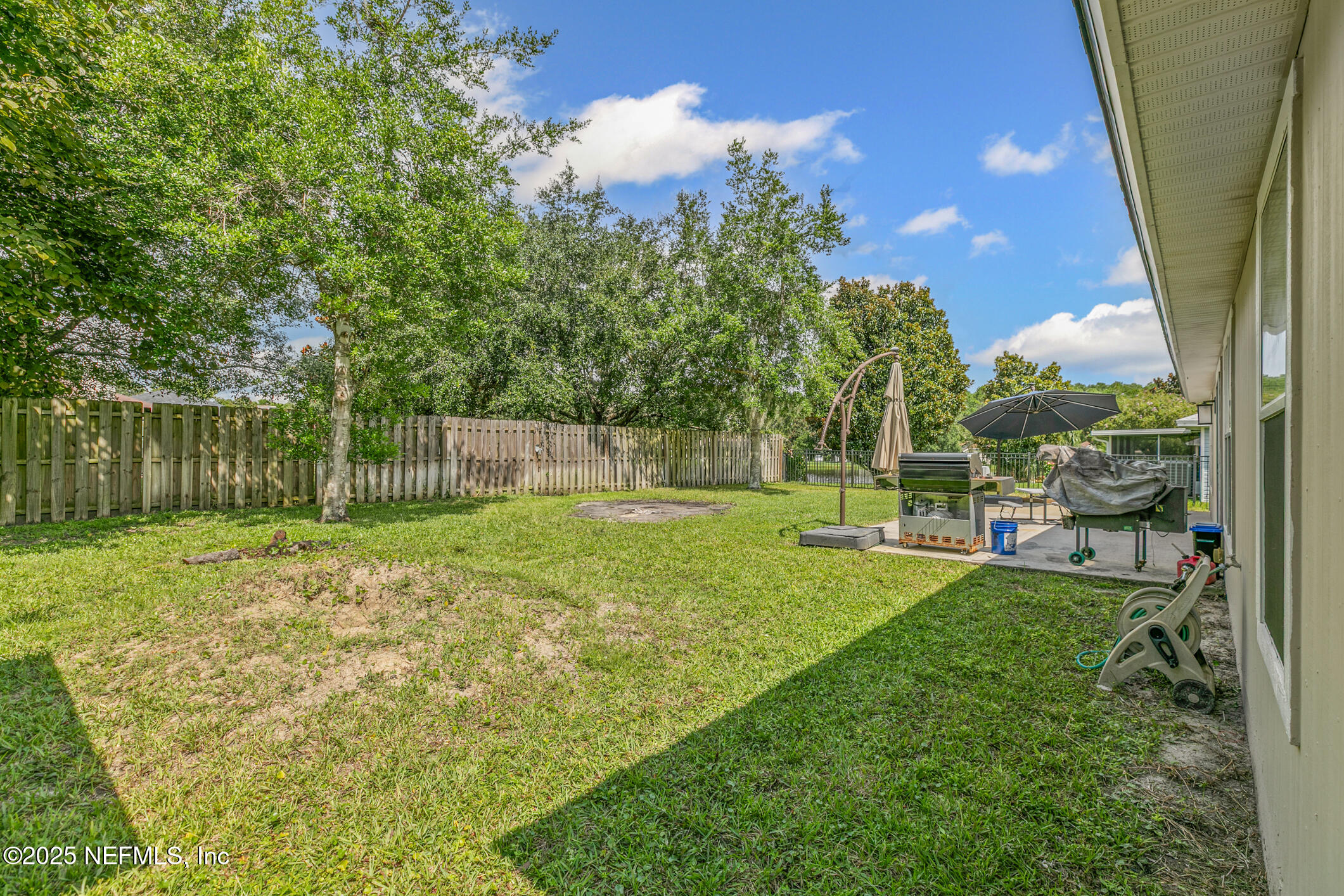 1725 South Summer Ridge Court St. Augustine, FL 32092 - Photo 43 of 46 a view of a yard with a house