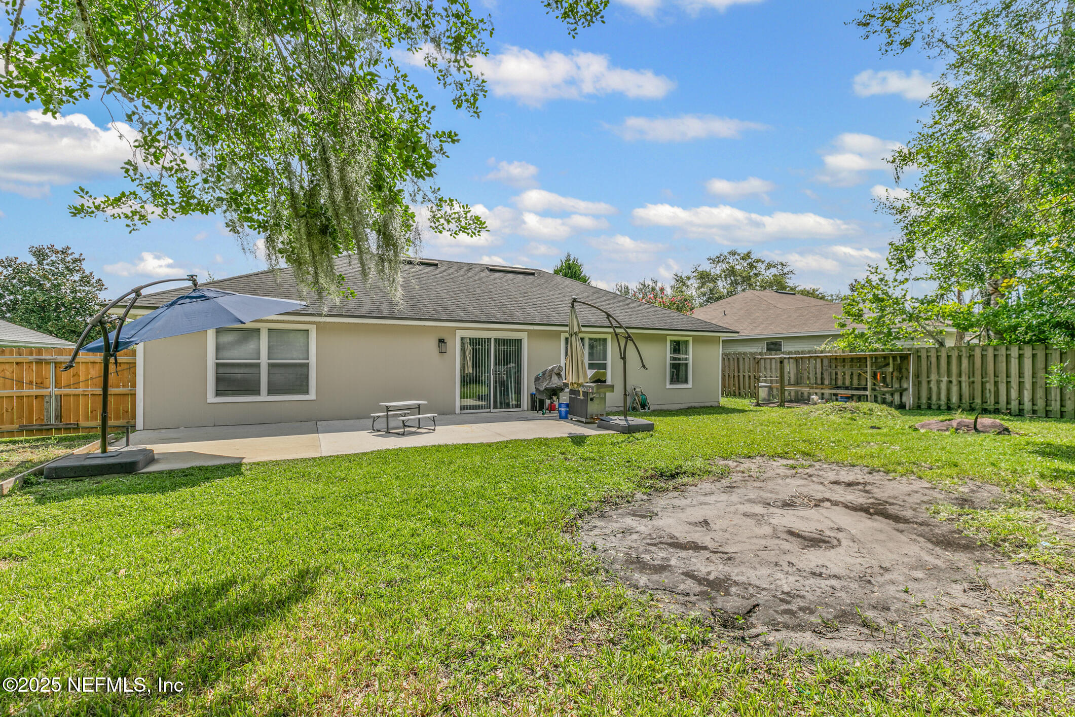 1725 South Summer Ridge Court St. Augustine, FL 32092 - Photo 45 of 46 a front view of a house with a yard and porch