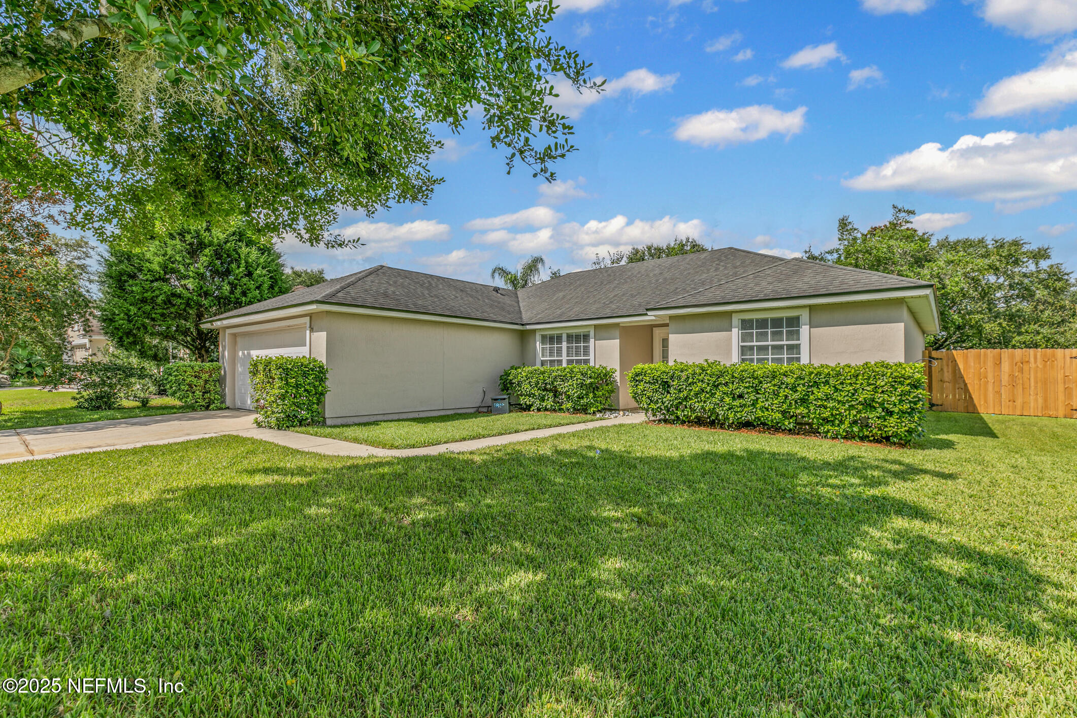 1725 South Summer Ridge Court St. Augustine, FL 32092 - Photo 6 of 46 a front view of a house with a yard and garage
