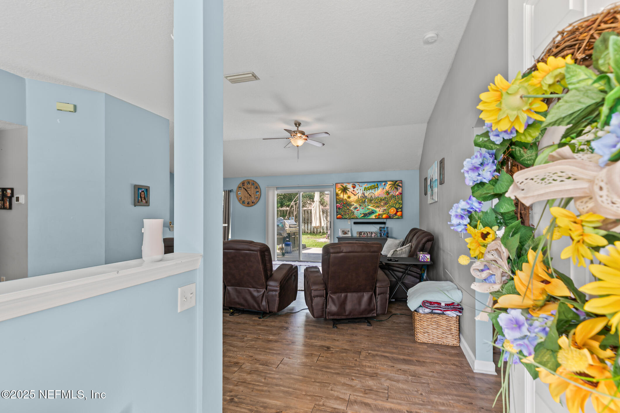 1725 South Summer Ridge Court St. Augustine, FL 32092 - Photo 8 of 46 a living room with furniture and a chandelier