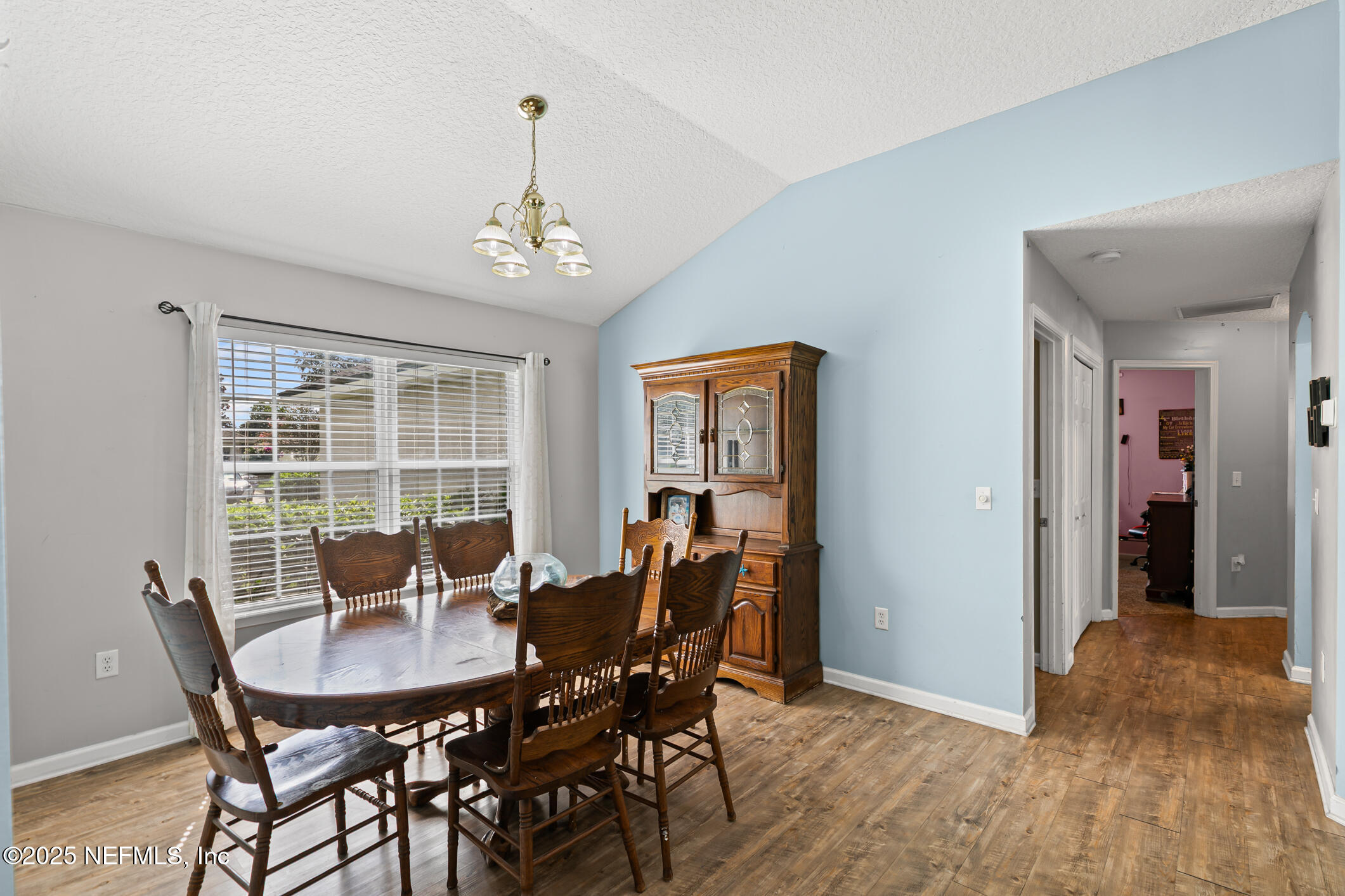 1725 South Summer Ridge Court St. Augustine, FL 32092 - Photo 10 of 46 a view of a dining room with furniture window and wooden floor