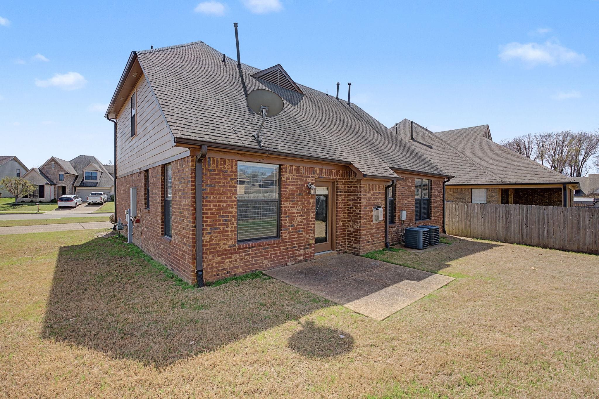 12436 Dusty Field Road Arlington, TN 38002 - Photo 34 of 40 Rear view of house featuring a patio area, brick siding, and a shingled roof