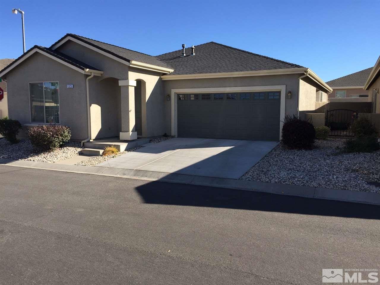 1325 Partridge Drive Carson City, NV 89701 - Photo 2 of 3 a front view of a house with garden