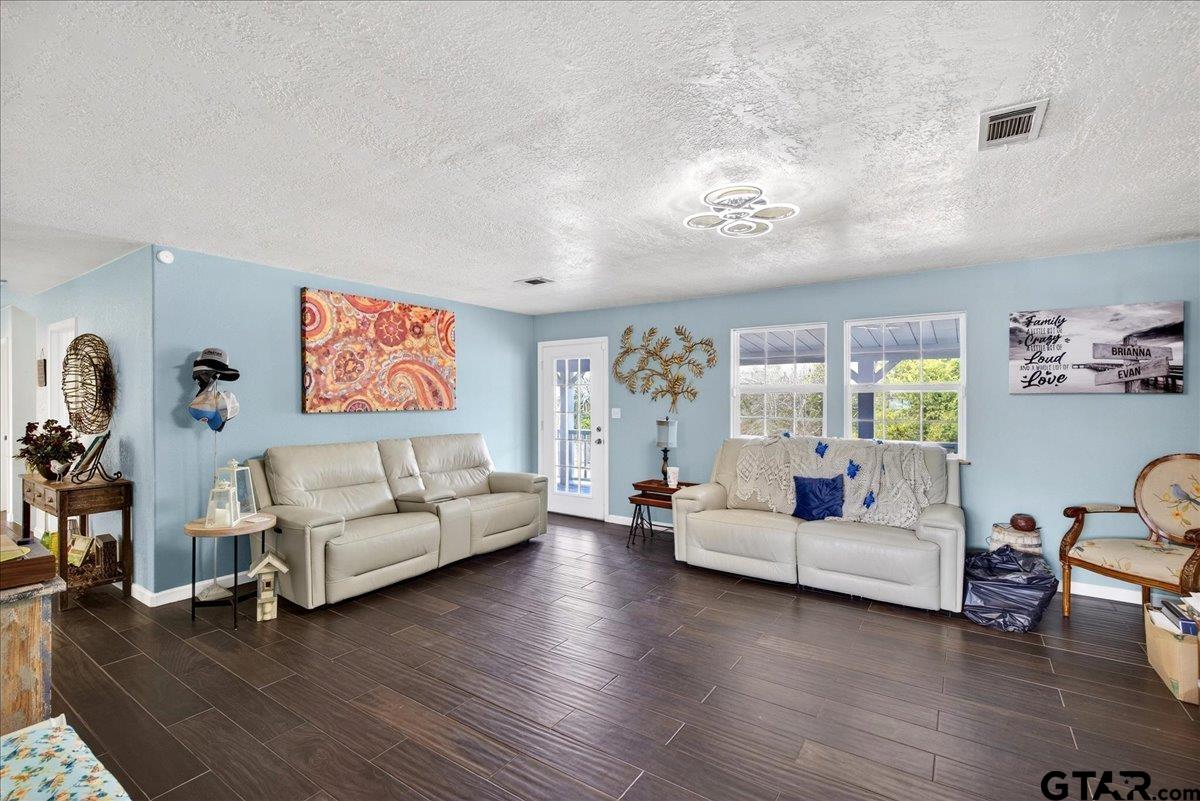 2375 County Road 3282 Buffalo, TX 75831 - Photo 12 of 48 a living room with furniture and a wooden floor