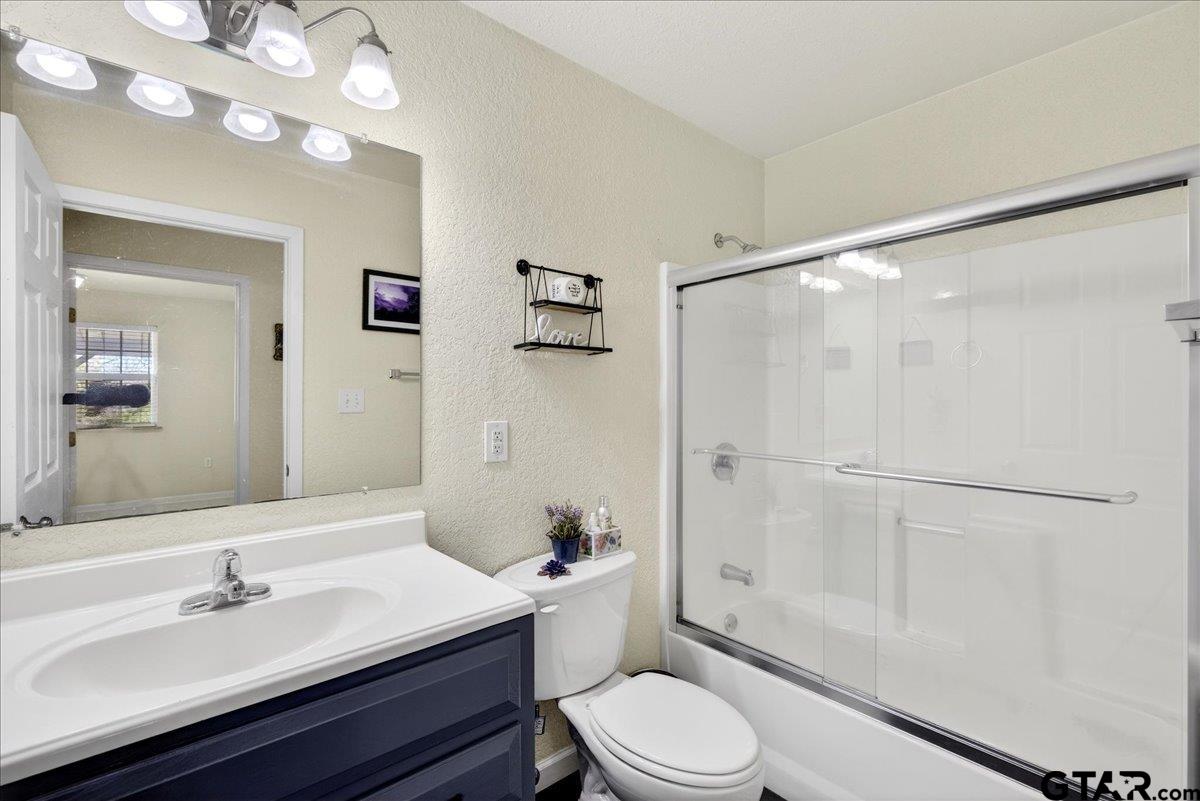 2375 County Road 3282 Buffalo, TX 75831 - Photo 15 of 48 a bathroom with a sink a toilet and shower
