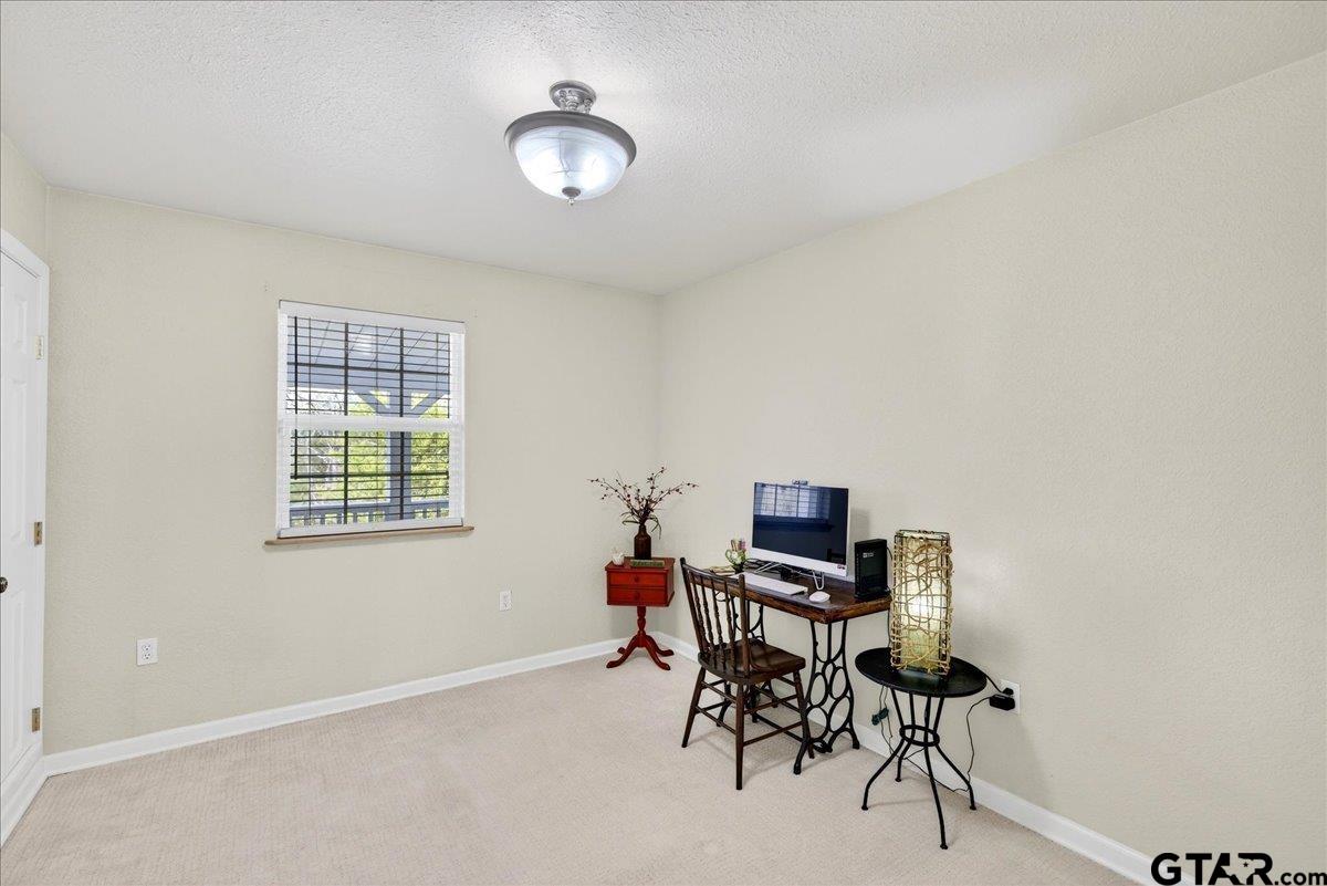 2375 County Road 3282 Buffalo, TX 75831 - Photo 25 of 48 a view of a workspace with furniture and a window