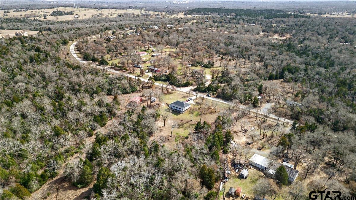 2375 County Road 3282 Buffalo, TX 75831 - Photo 44 of 48 an aerial view of house with yard and mountain view in back