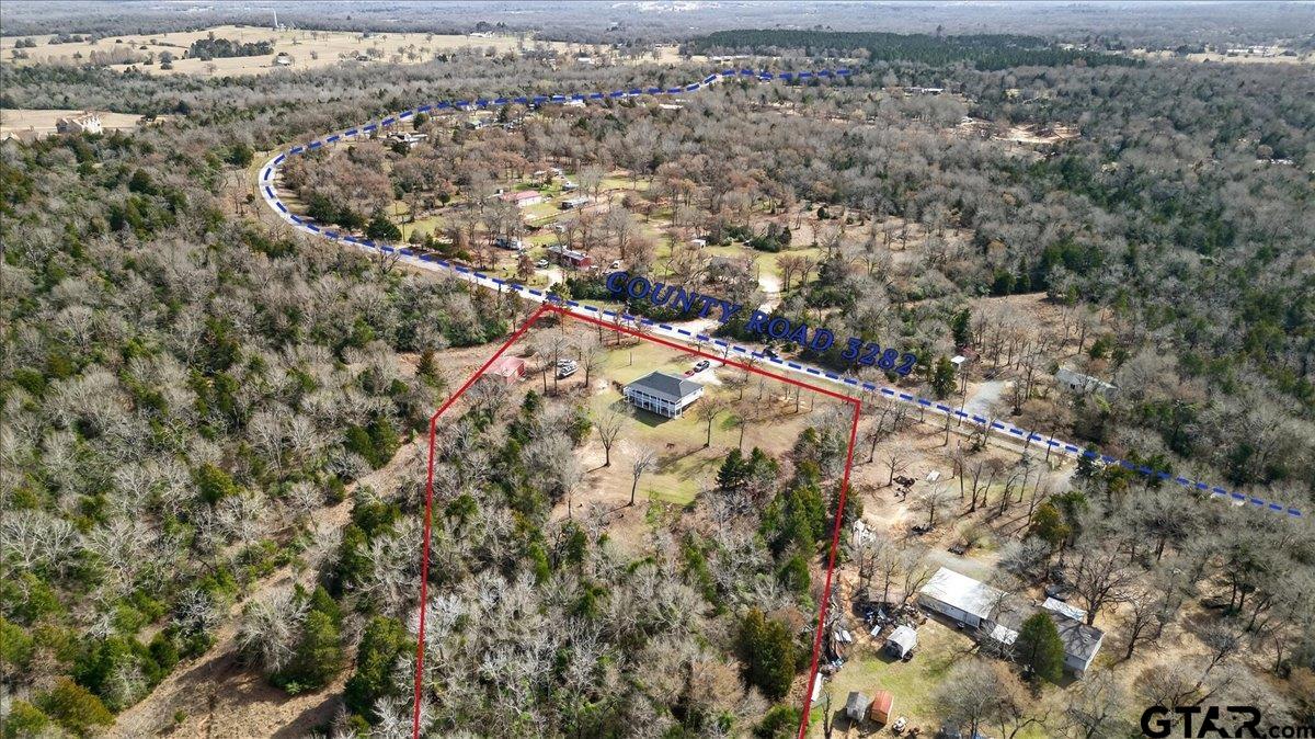 2375 County Road 3282 Buffalo, TX 75831 - Photo 45 of 48 an aerial view of house with yard and mountain view in back