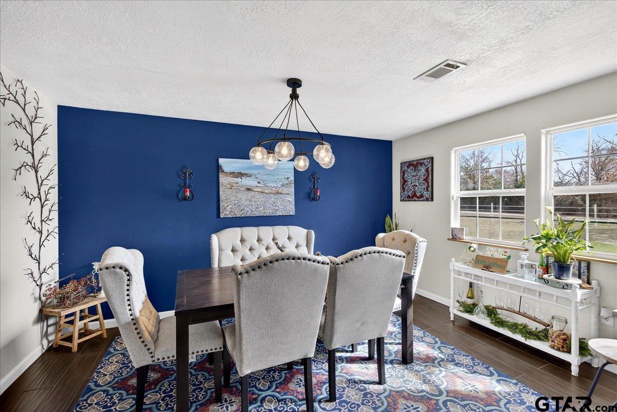 2375 County Road 3282 Buffalo, TX 75831 - Photo 7 of 48 a view of a dining room with furniture window and wooden floor