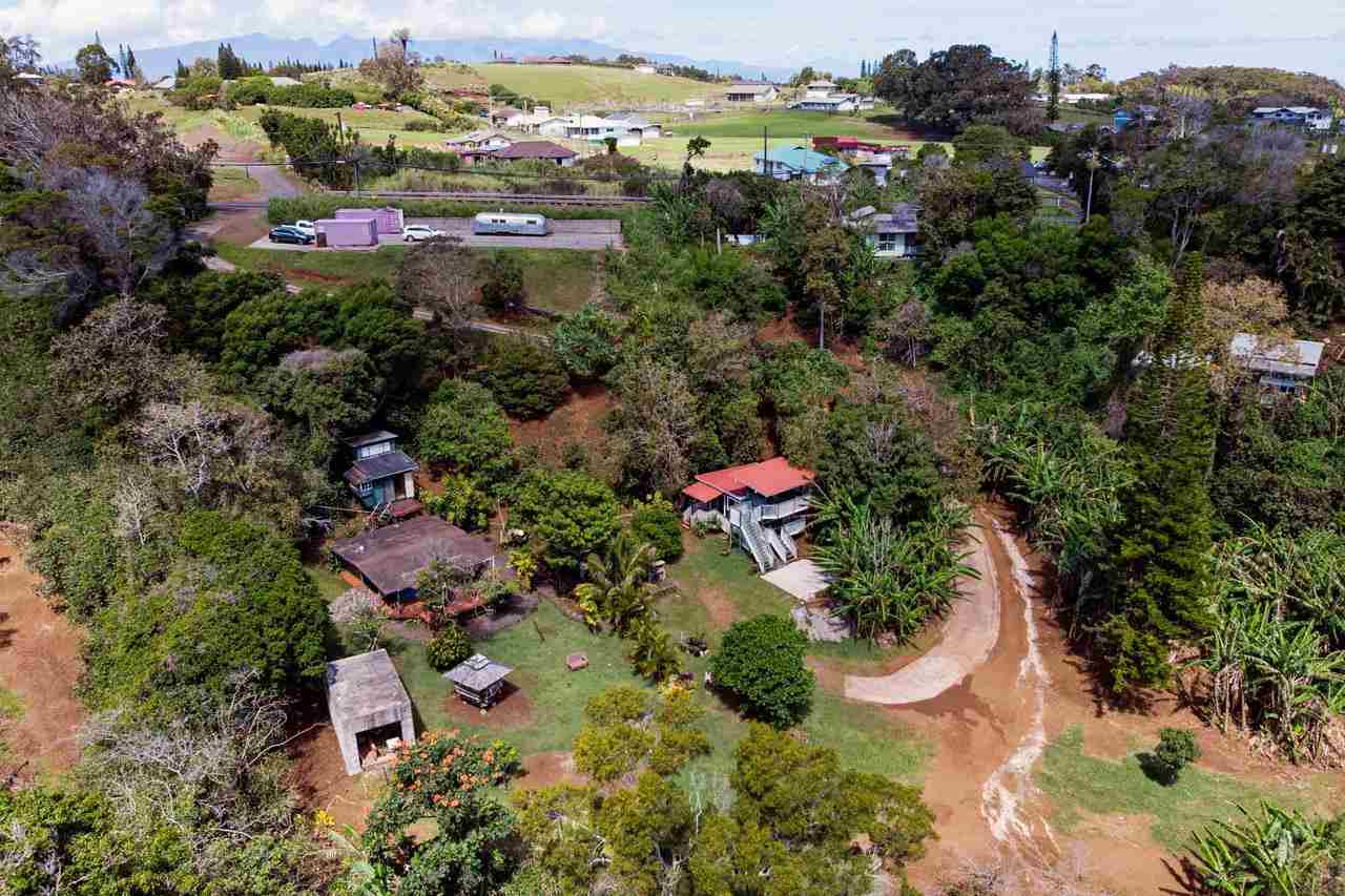 2665 Kaupakalua Road Haiku, HI 96708 - Photo 1 of 25 an aerial view of a house with a yard and outdoor seating
