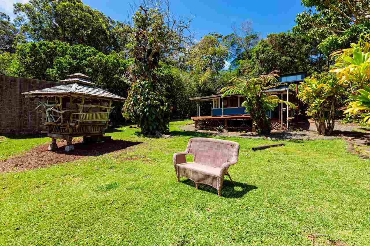 2665 Kaupakalua Road Haiku, HI 96708 - Photo 18 of 25 a view of a yard with furniture and a fire pit