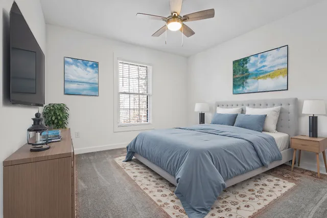 a bedroom with bed and window