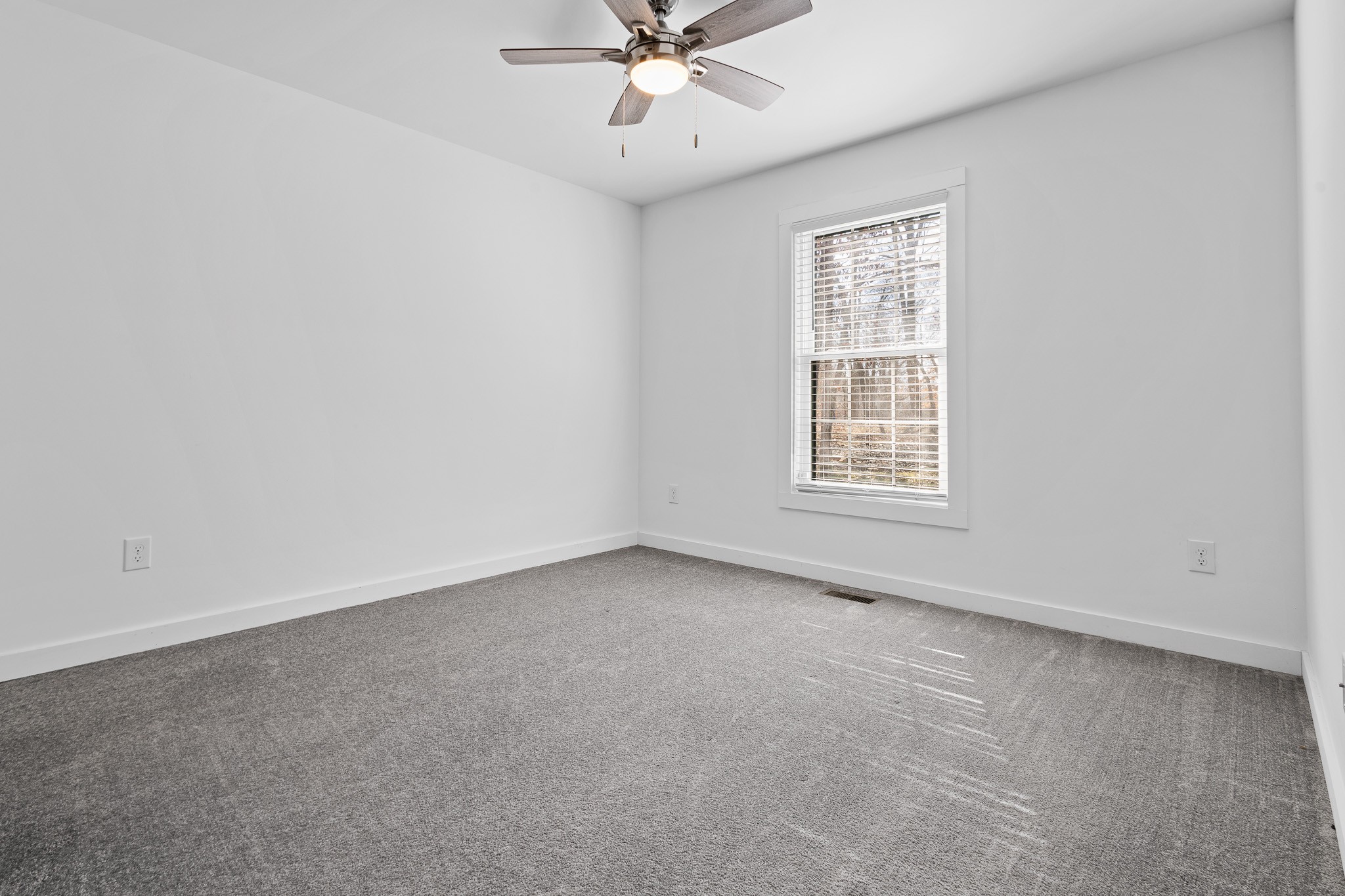 1517 Ridgeview Run Lynchburg, TN 37352 - Photo 17 of 37 an empty room with a window and a ceiling fan