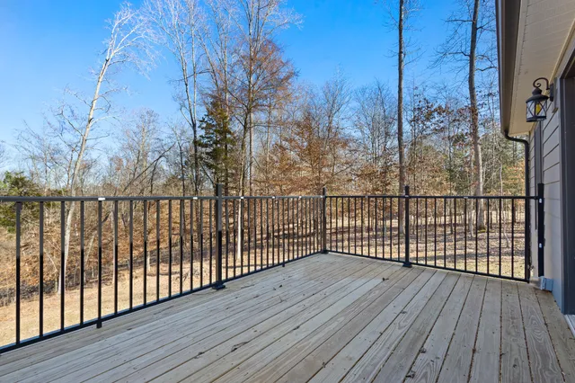 a view of a balcony with wooden floor