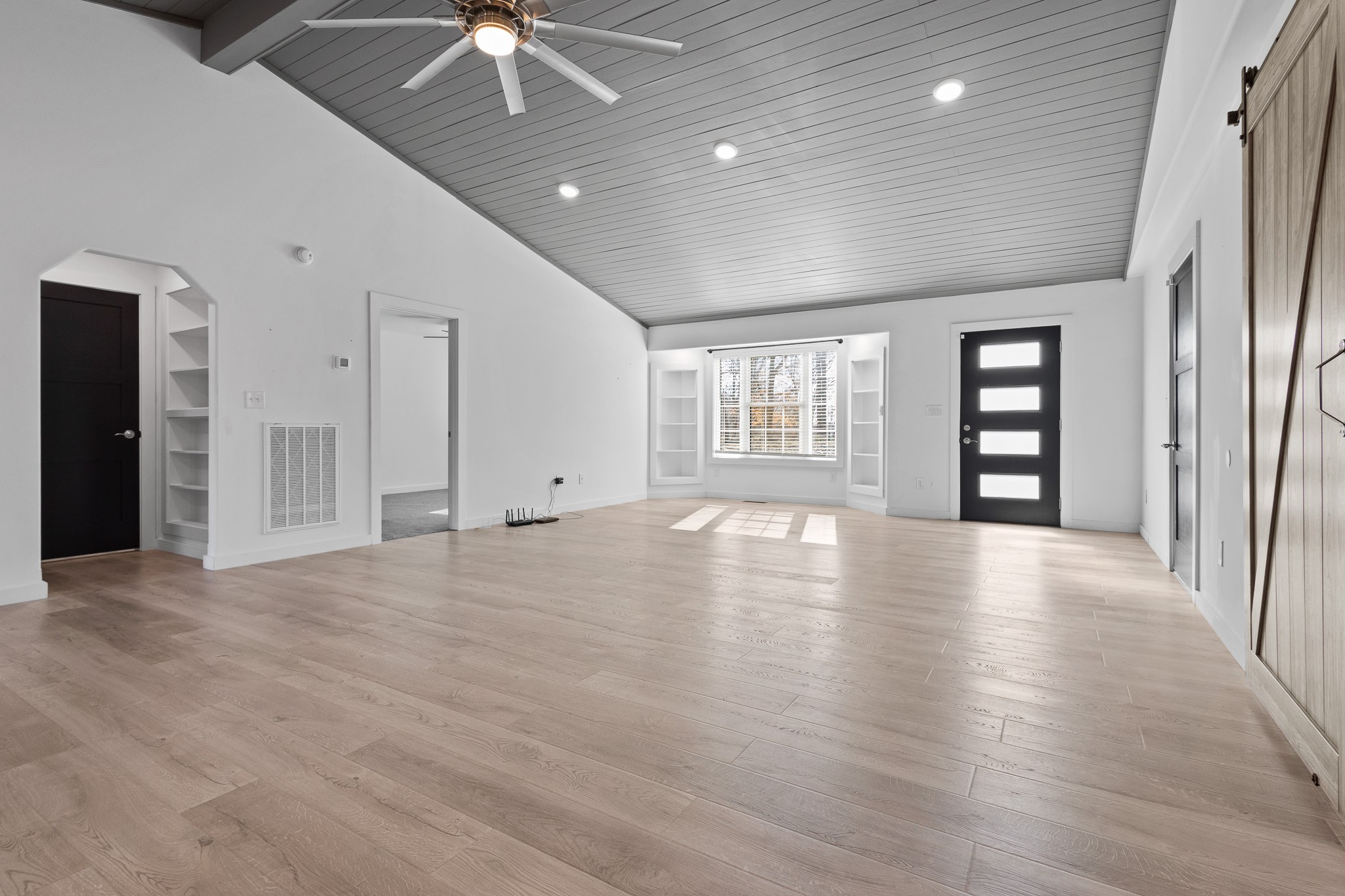 1517 Ridgeview Run Lynchburg, TN 37352 - Photo 3 of 37 an empty room with chandelier fan and windows
