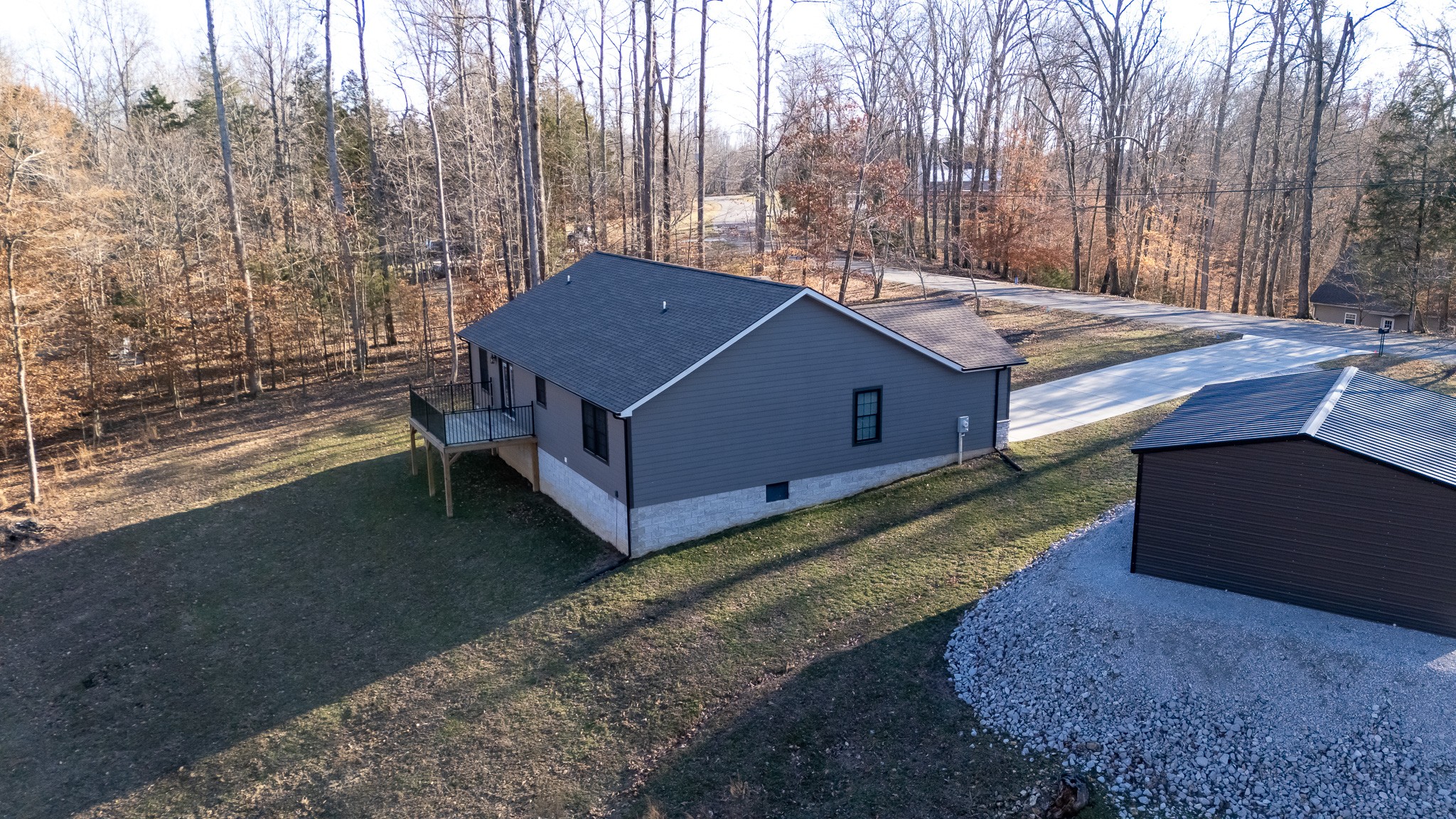 1517 Ridgeview Run Lynchburg, TN 37352 - Photo 33 of 37 a backyard of a house with barbeque oven table and chairs