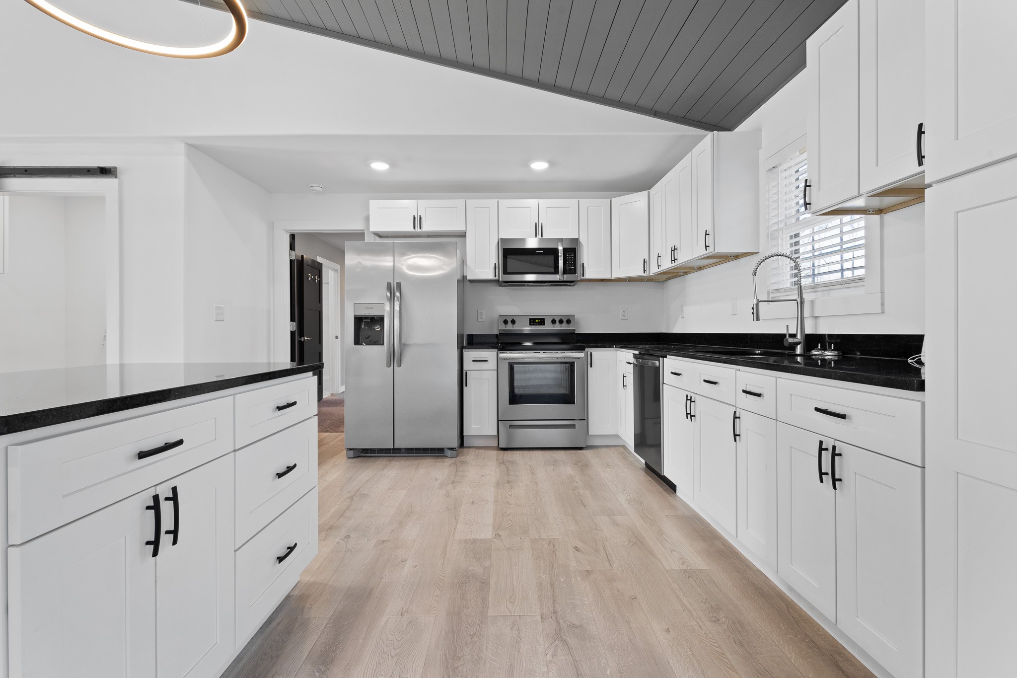 1517 Ridgeview Run Lynchburg, TN 37352 - Photo 4 of 37 a kitchen with granite countertop white cabinets and stainless steel appliances