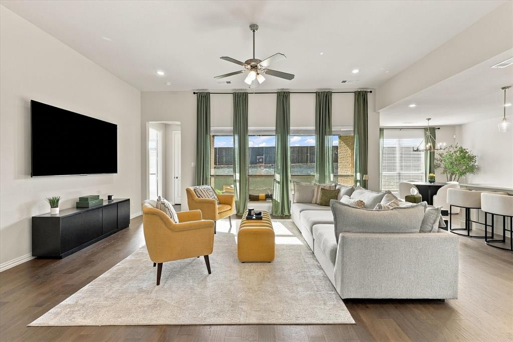 137 Chisos Court Rhome, TX 76078 - Photo 1 of 40 High ceilings, wood-finish flooring, recessed lighting, ceiling fan, and extensive window treatments
