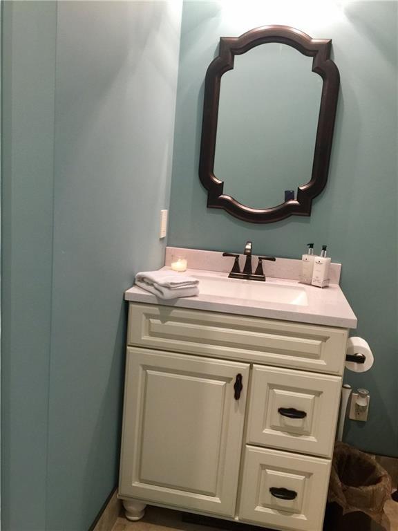 540 Zions Hill Road Chesterville, ME 04938 - Photo 18 of 31 Guest bath vanity and mirror.
