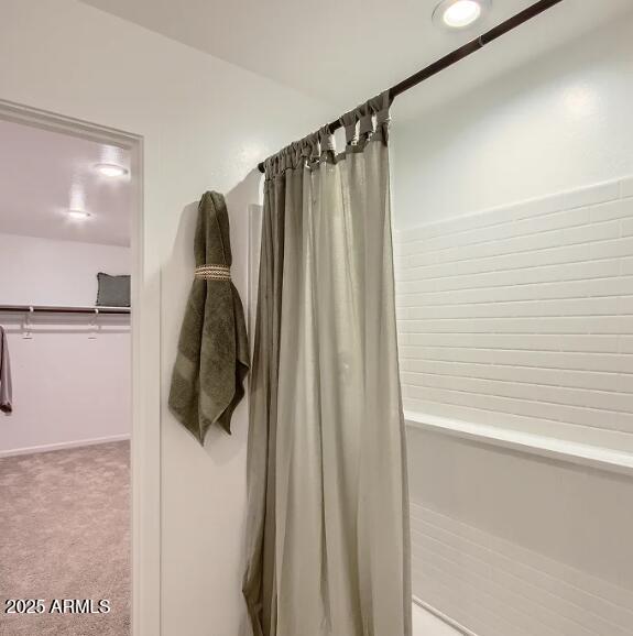 9517 West Cheery Lynn Road Phoenix, AZ 85392 - Photo 11 of 27 a bathroom with a shower and a tub