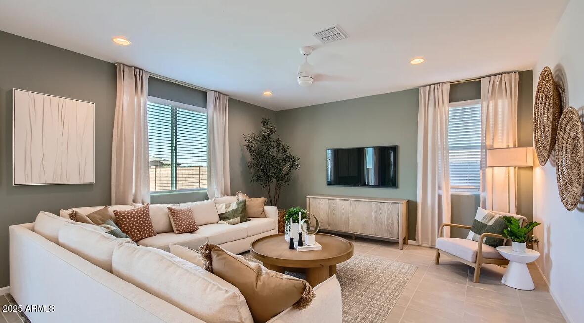 9517 West Cheery Lynn Road Phoenix, AZ 85392 - Photo 6 of 27 a living room with furniture and a flat screen tv