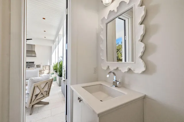 a large bedroom with a bed and a flat tv screen on the dresser