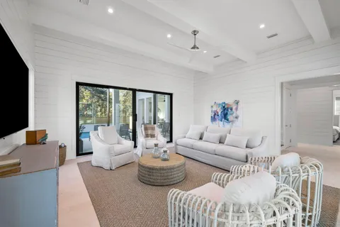 a living room with furniture and a rug