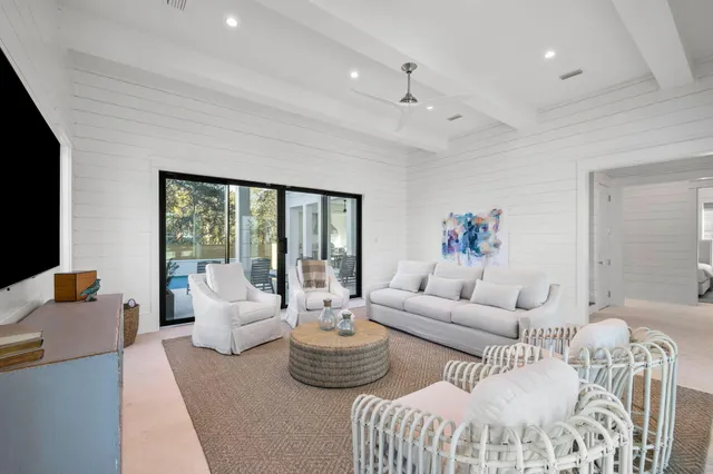a living room with furniture and a rug