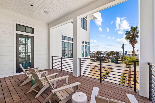 a large kitchen with kitchen island a large island a sink stainless steel appliances and cabinets