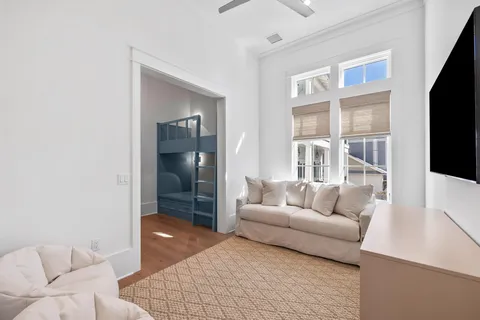 a very nice looking room with a large window and wooden floor