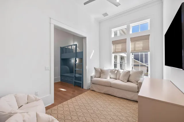 a very nice looking room with a large window and wooden floor