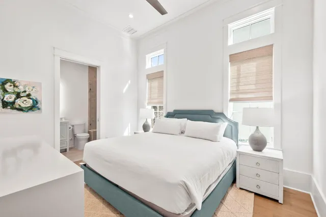a view of a dining room with furniture wooden floor and chandelier