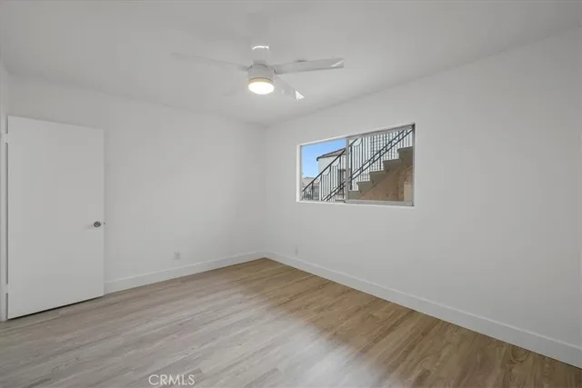wooden floor in an empty room with a workspace