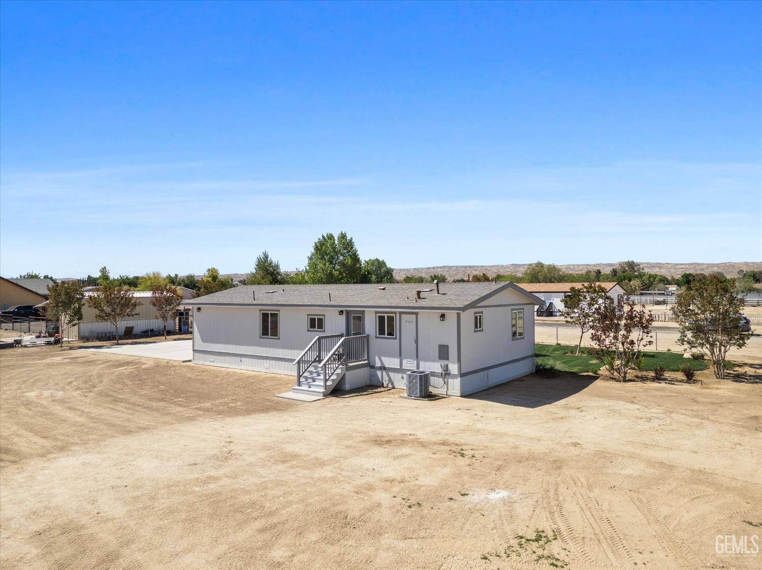 Undisclosed Address Taft, CA 93268 - Photo 8 of 40 a view of a terrace with a bench