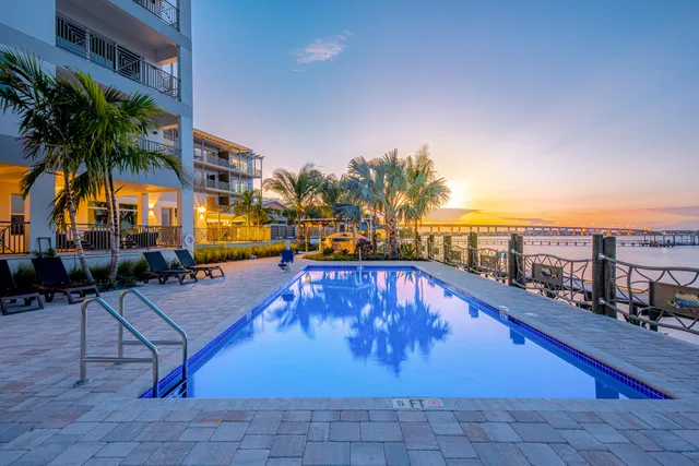 a swimming pool with outdoor seating and yard