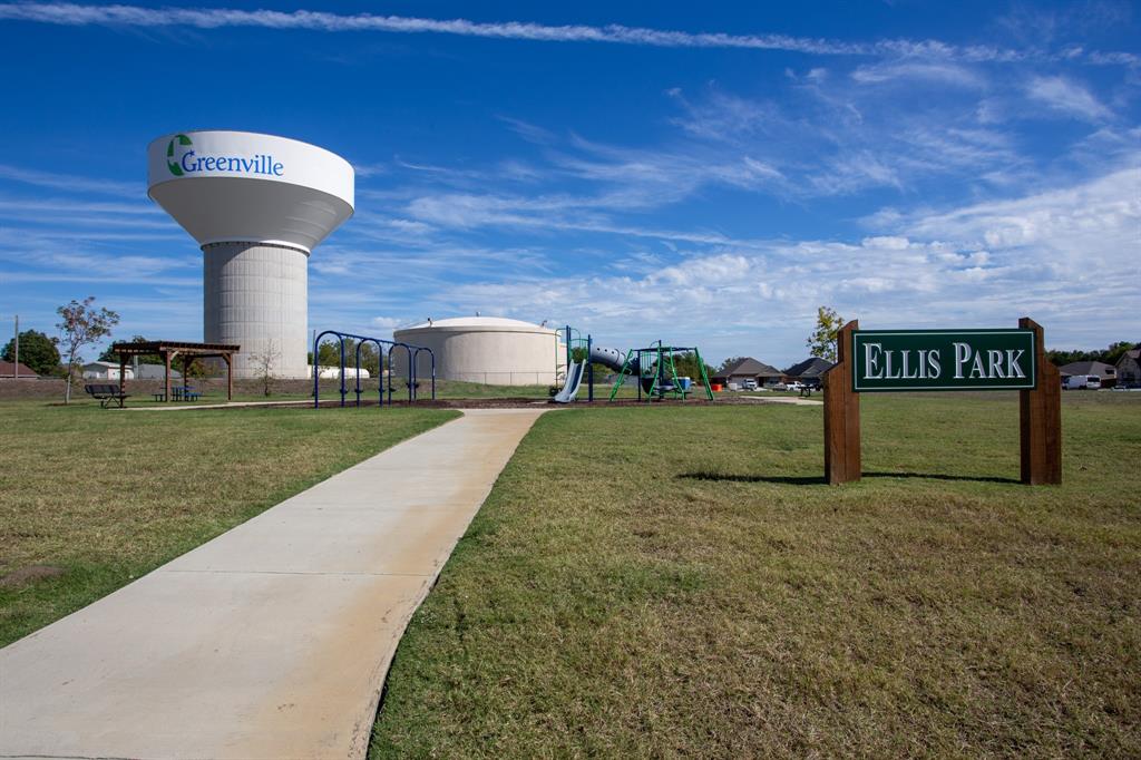 804 Ransom Way Greenville, TX 75402 - Photo 21 of 22 Ellis Park features a concrete pathway, grassy areas, and a dedicated playground structure
