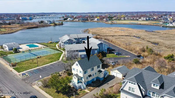 an aerial view of a house with outdoor space