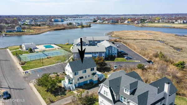 an aerial view of a house with outdoor space