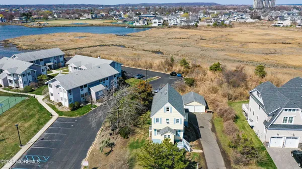 an aerial view of a house with a lake view