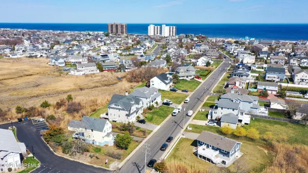 an aerial view of a house with a ocean view