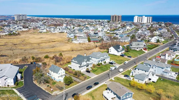 an aerial view of a house with a ocean view