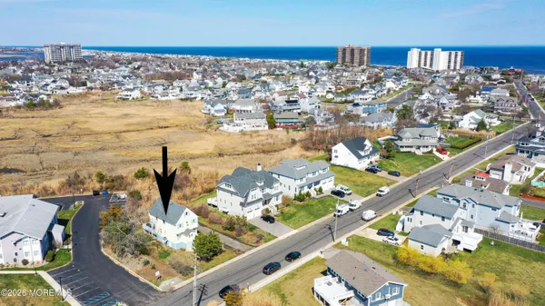 an aerial view of a house with outdoor space