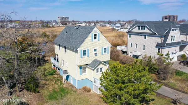 an aerial view of a house with a lake view