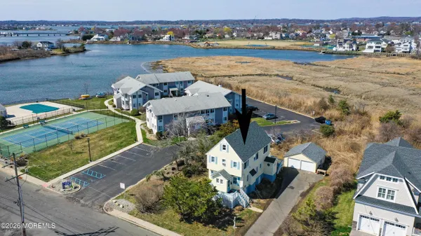 an aerial view of a house with outdoor space