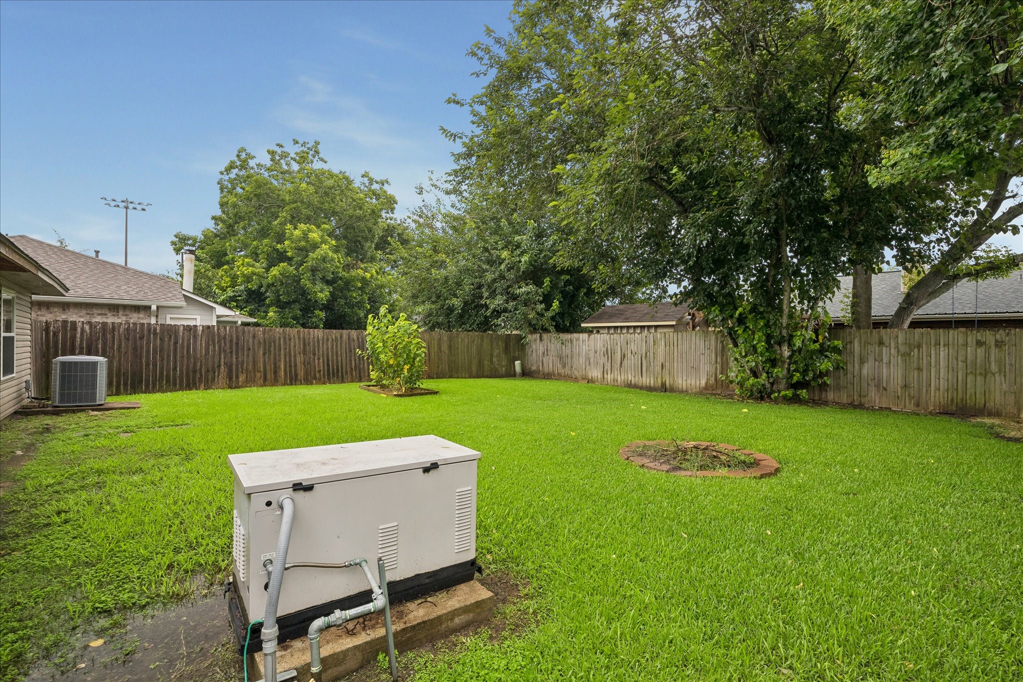 16715 Benchmark Drive Houston, TX 77053 - Photo 14 of 14 a backyard of a house with table and chairs