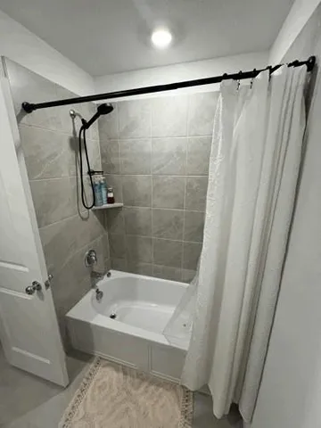 a room with furniture and a flat screen tv